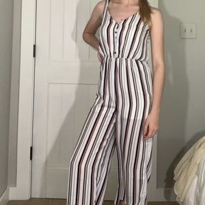 white, blue, and red striped jumpsuit